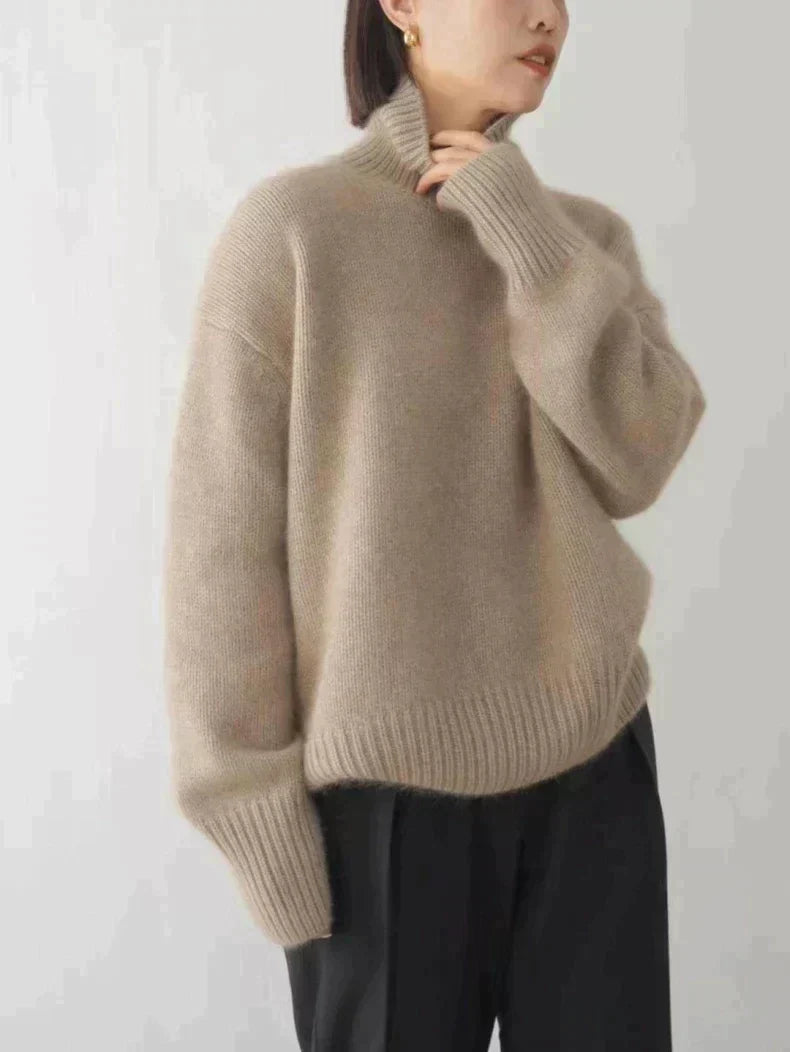 Women's elegant high collar sweater, a cozy knit top perfect for versatile autumn fashion and winter outfits.