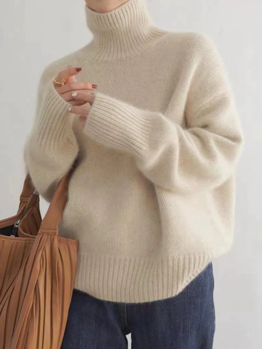 Elegant women's high-neck sweater in soft knit for luxurious comfort & warmth, perfect for fall & winter fashion.