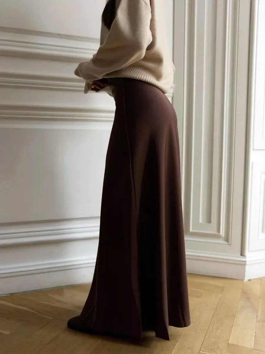 Flowy elegant women's high waist maxi skirt with a chic fishtail hem, flattering fit.