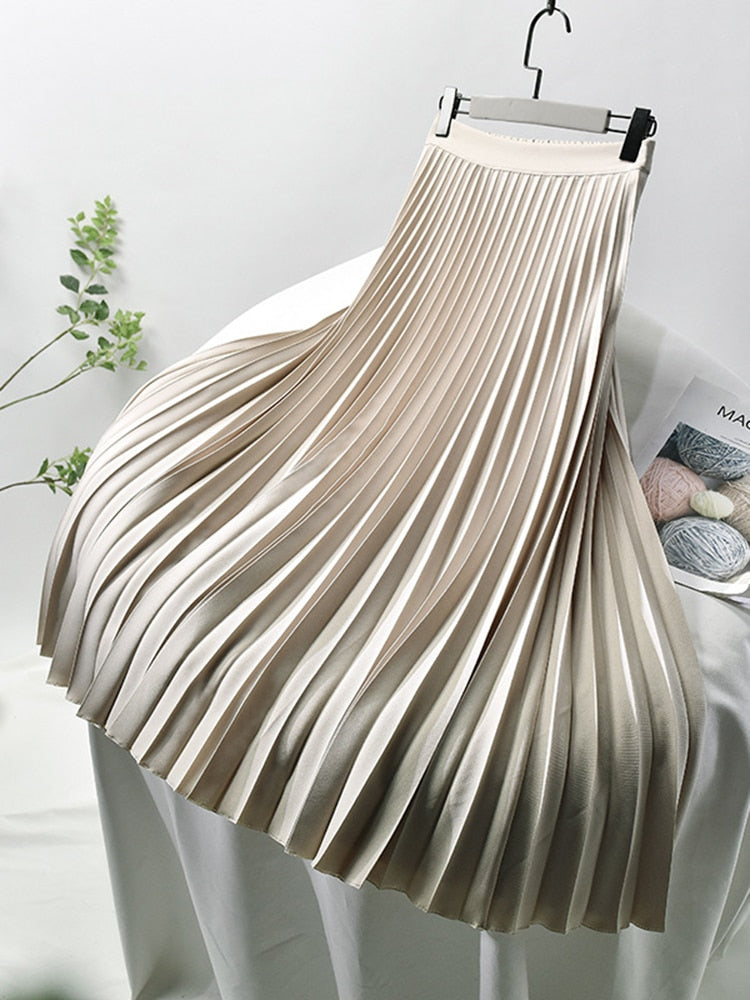 Elegant women's high waist pleated midi skirt. Versatile for casual or formal wear, a chic wardrobe staple.