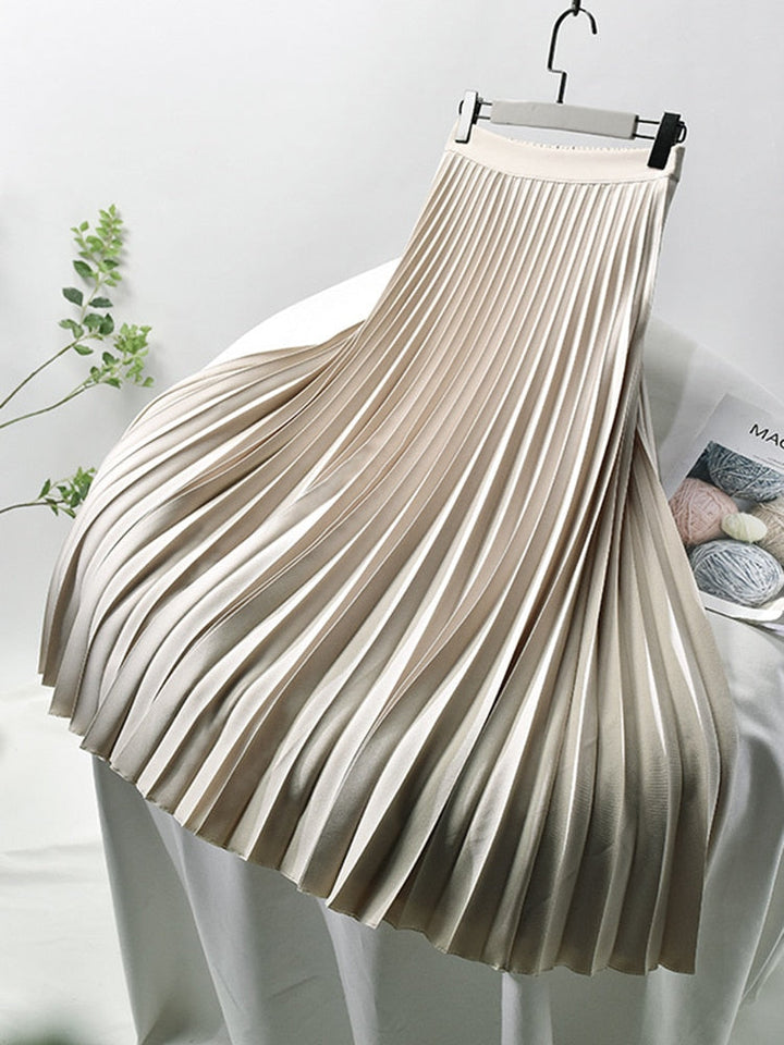 Elegant women's high waist pleated midi skirt. Versatile for casual or formal wear, a chic wardrobe staple.