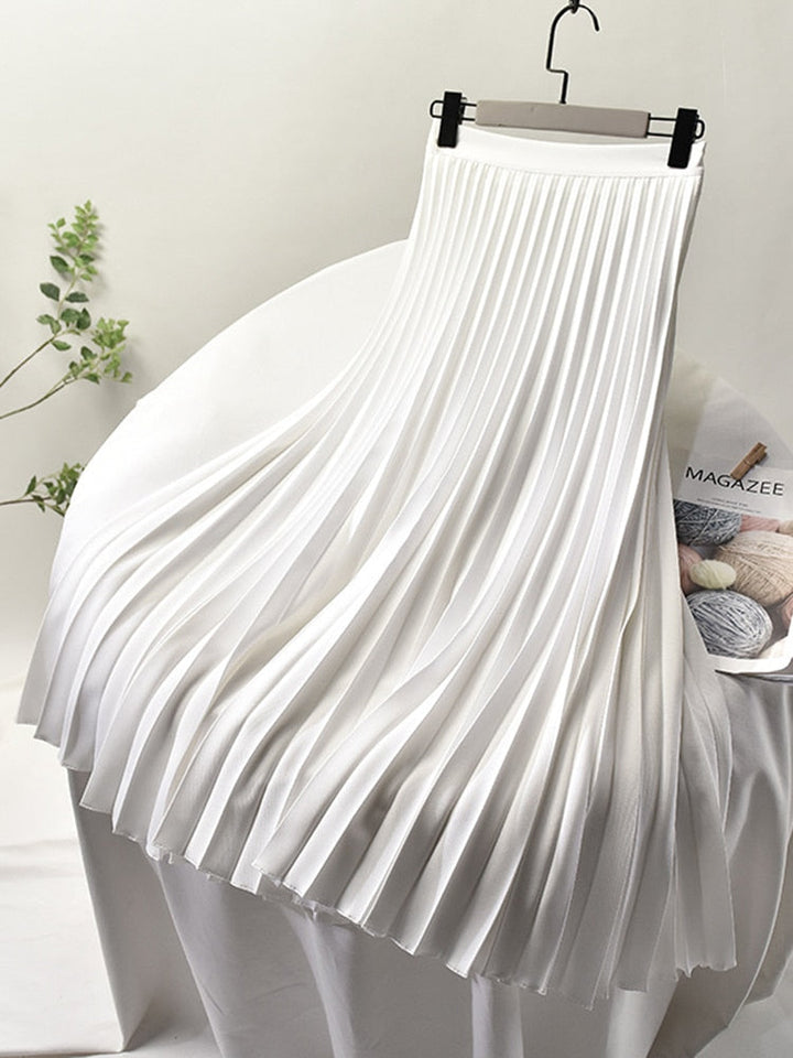 Stylish women's high waist pleated skirt. Elegant design, versatile midi length, a chic must-have for any wardrobe.
