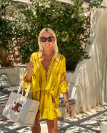 Stylish women's high waist V-neck mini dress. Elegant, flattering sleeveless design for versatile summer and party wear.