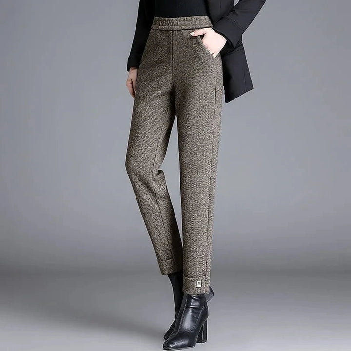 Elegant women's high-waisted herringbone tailored trousers with a slim fit, ideal for office or chic casual wear.