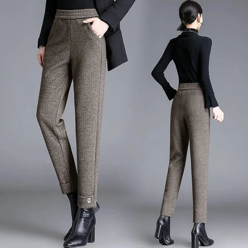 Chic women's herringbone tailored pants, a versatile high-waisted design for sophisticated work or casual outfits.