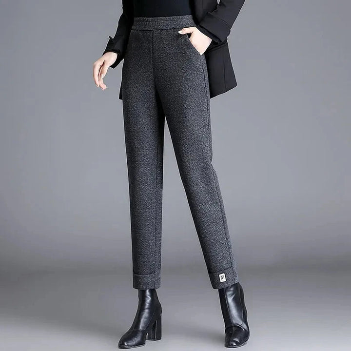 Slim fit women's herringbone trousers, tailored for a flattering look, perfect as professional office wear.