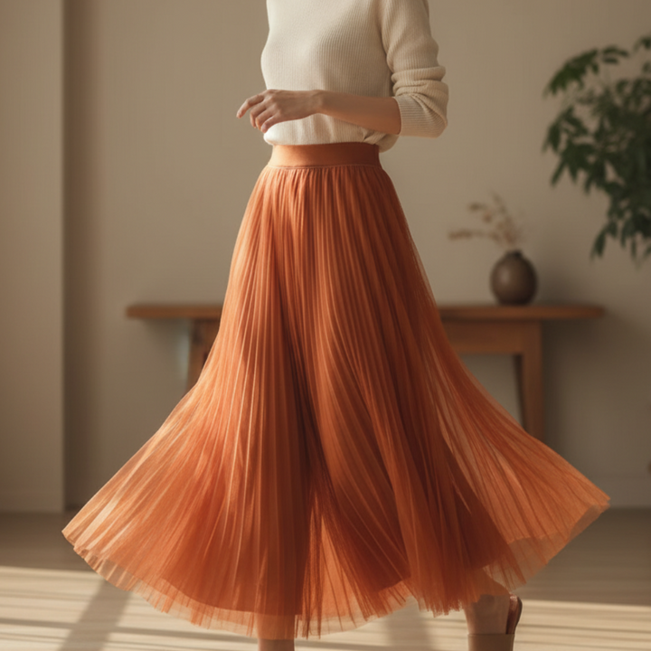 Elegant women's high-waisted pleated midi skirt in a flowing A-line design. Perfect for versatile styling.
