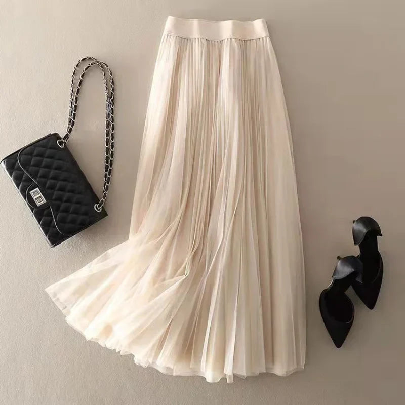 Casual chic women's high-waisted pleated midi skirt. An elegant and versatile A-line design for everyday style.