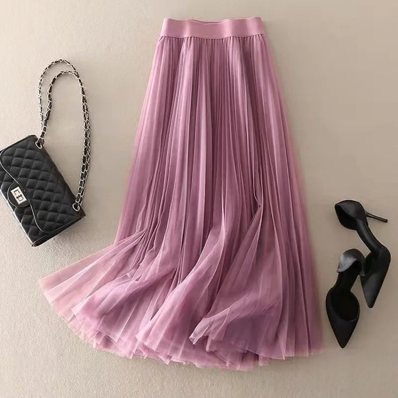 Modest high-waisted pleated midi skirt for women. Elegant A-line silhouette, perfect for spring and summer fashion.