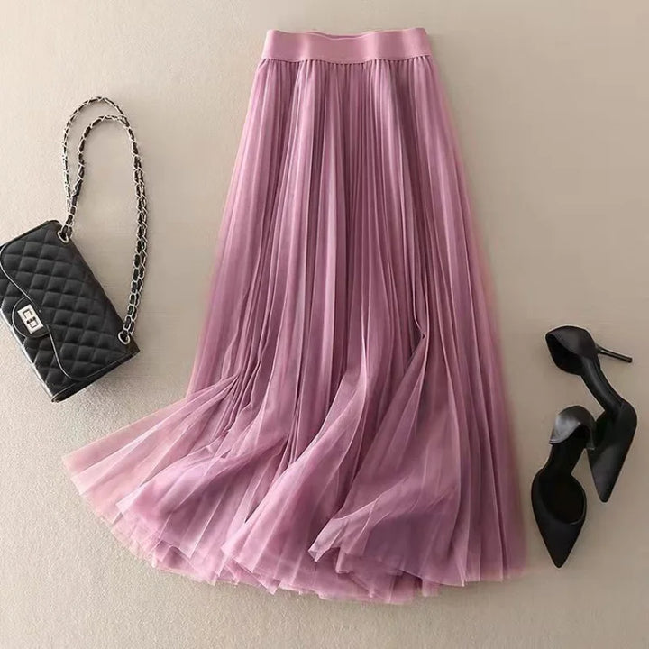 Modest high-waisted pleated midi skirt for women. Elegant A-line silhouette, perfect for spring and summer fashion.