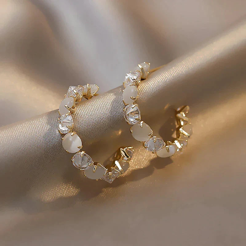 Elegant women's iridescent opal drop earrings in stainless steel, perfect for a gift.