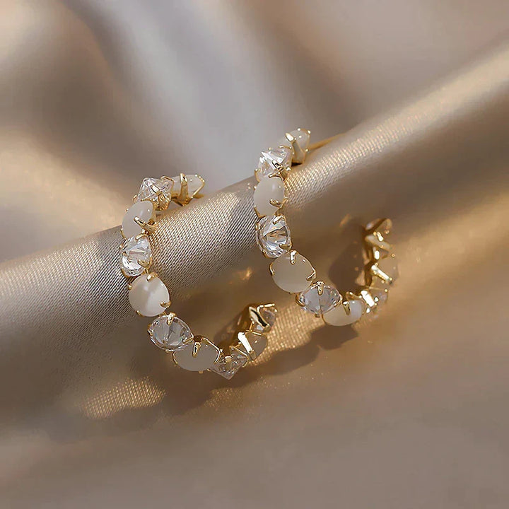 Elegant women's iridescent opal drop earrings in stainless steel, perfect for a gift.