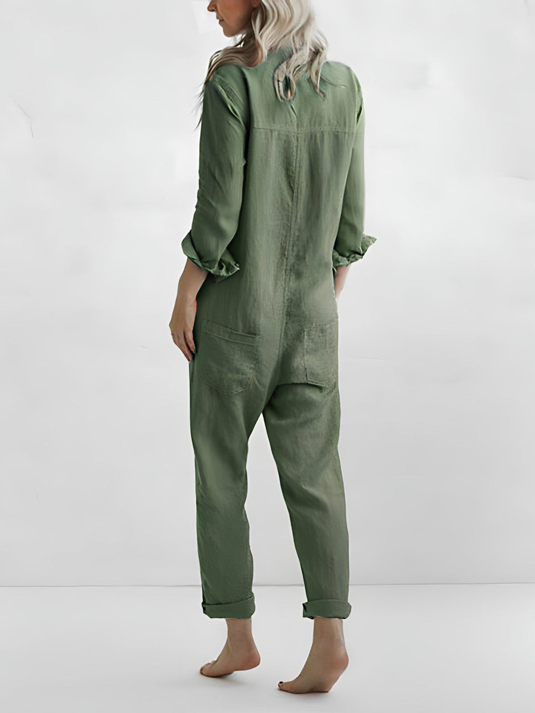 Modern women's solid color jumpsuit. This fashionable one-piece features an elegant reversible collar.