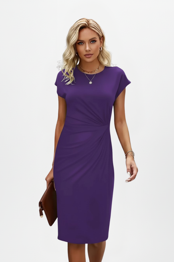 Women's elegant knee-length dress in a solid color, with cap sleeves and a lovely ruched waist. Very versatile.