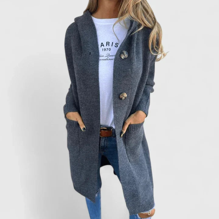 Stylish women's elegant knit cardigan with front pockets, perfect for layering over spring outfits.