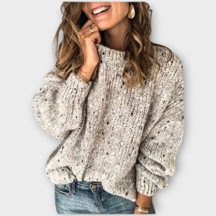 Elegant women's knit sweater, long-sleeve crew neck. Sophisticated & cozy for fall/winter fashion.