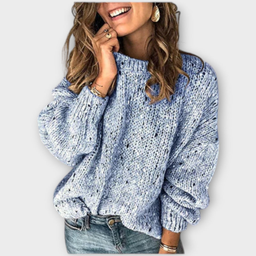 Cozy women's knit sweater, classic long-sleeve crew neck. Versatile elegant top for sophisticated fall style.