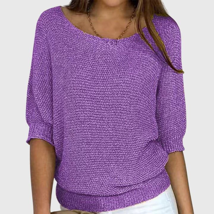 Women's elegant knit sweater in a flattering, comfortable design. A versatile, all-season wardrobe staple for chic style.
