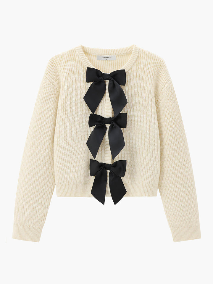 Elegant women's knit sweater with chic bow detail, perfect for stylish fall and winter fashion.