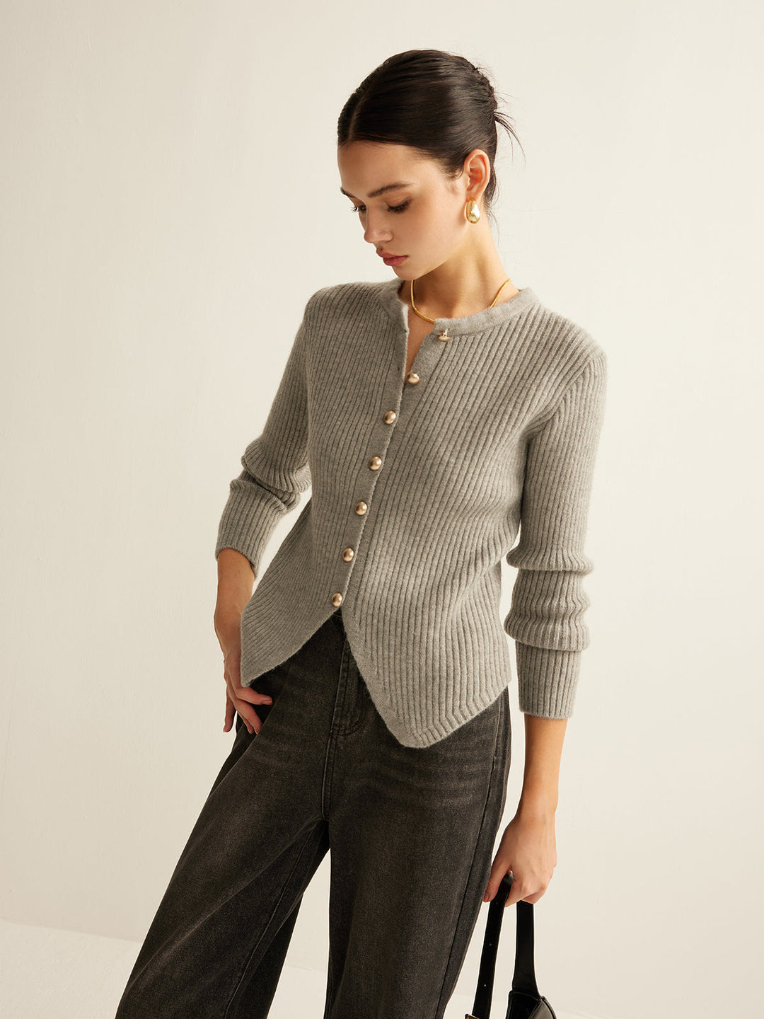 Elise women's knit sweater with charming button accents, a stylish and elegant top for any occasion.