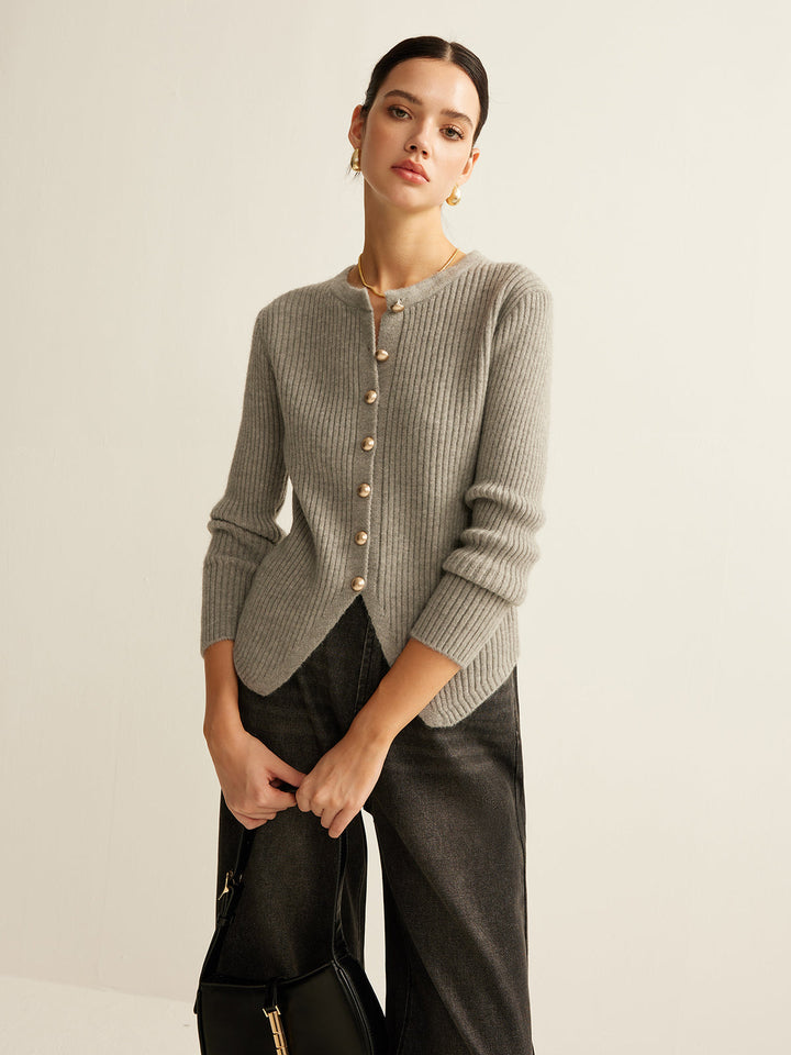 Fashionable women's knit sweater featuring elegant button details, perfect for a professional workwear look.