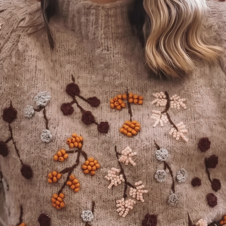 Stylish women's pullover with elegant knit pattern, ideal for long sleeve comfort.