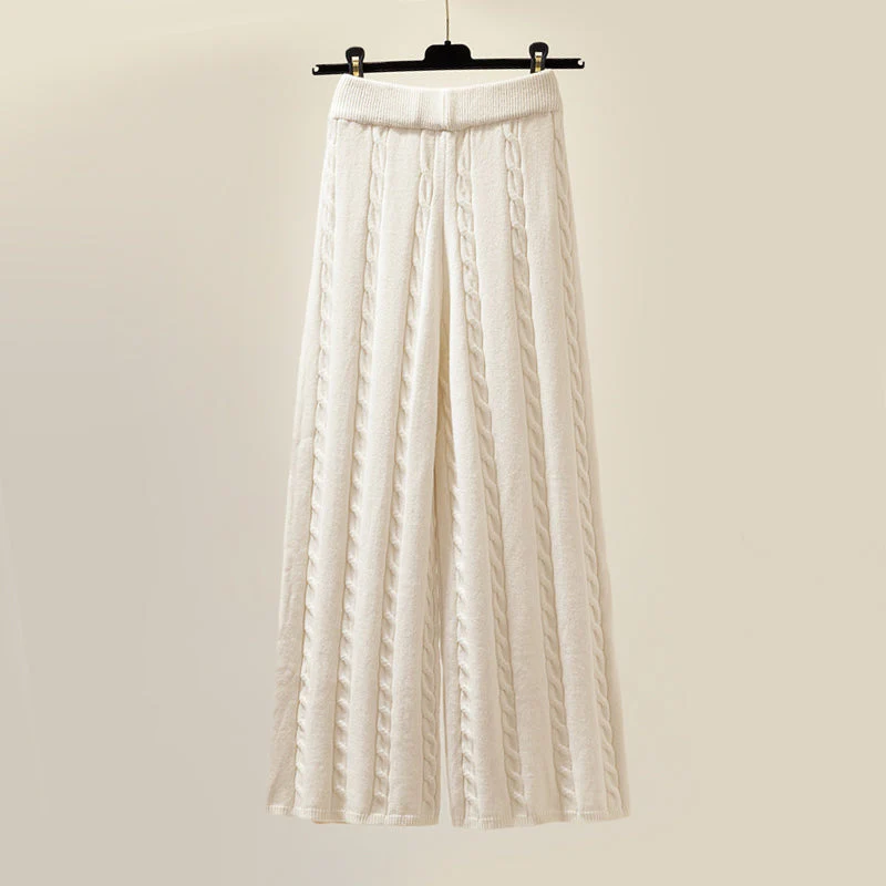 Women's two-piece knitted set featuring an elegant sweater & matching vest, perfect for chic winter style.
