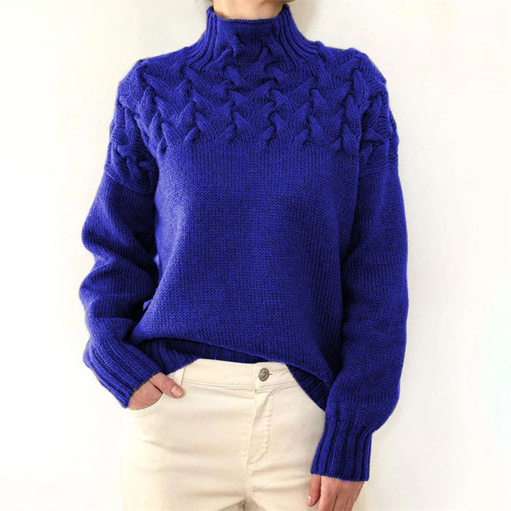 Classic fit women's knitted turtleneck sweater. Elegant long sleeve top, cozy and chic for winter fashion.