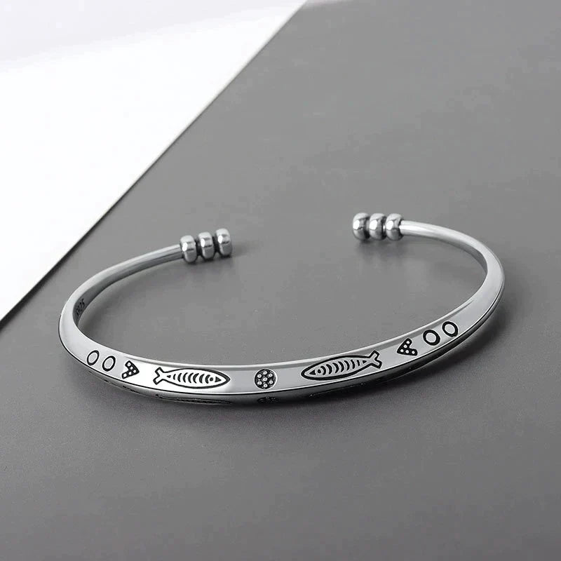 Elegant women's koi fish prosperity bracelet, symbolizing fortune & good luck. Stainless steel, adjustable fit.