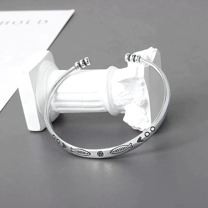 Close-up of elegant koi fish bracelet for women, detailed fish design, representing prosperity & fortune.