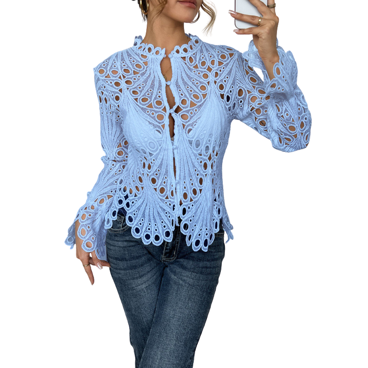 Stylish women's hollow-out lace blouse with intricate cutwork design. Elegant long sleeve top for spring wear.