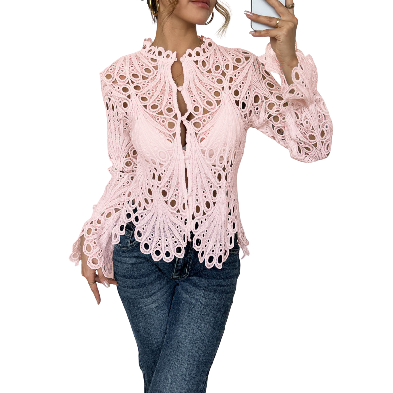 Casual elegant women's lace cutwork blouse. This chic long sleeve top is a feminine statement piece for spring.