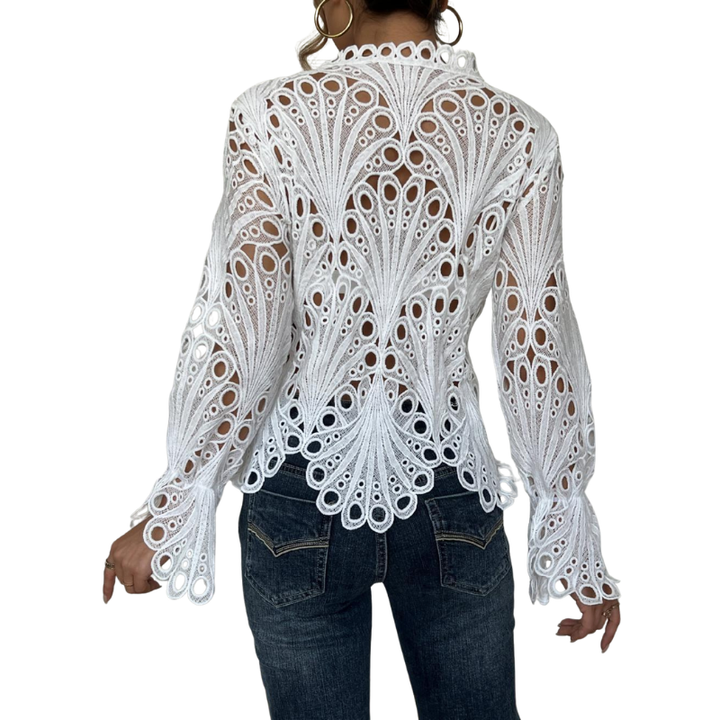 Women's elegant lace cutwork blouse with long lantern sleeves. A chic, feminine top with hollow out details.