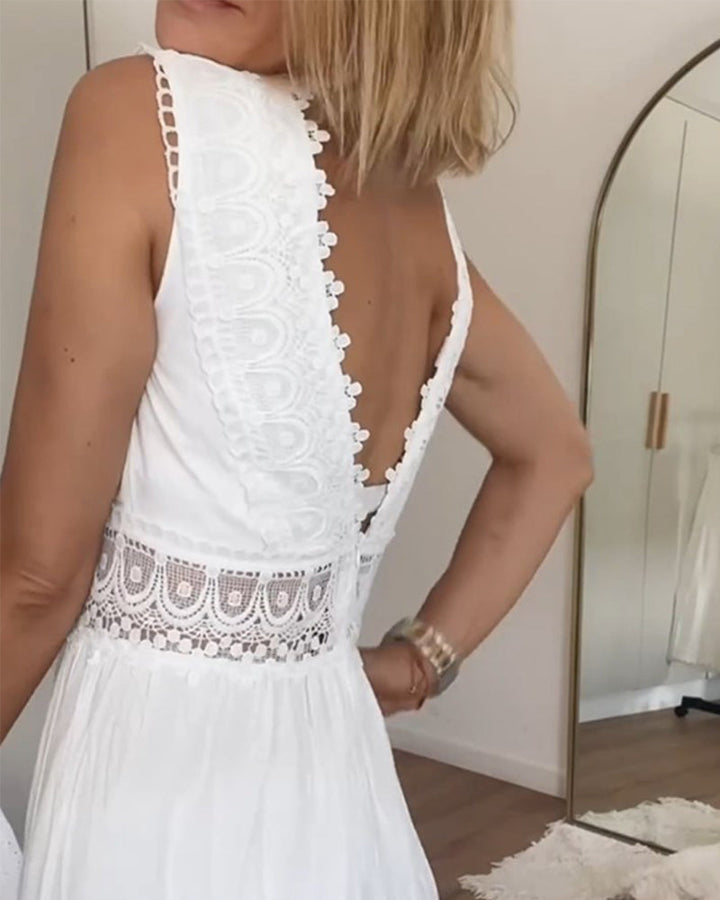 Woman sitting elegantly in a stylish lace midi dress, A-line cut, perfect for summer events.