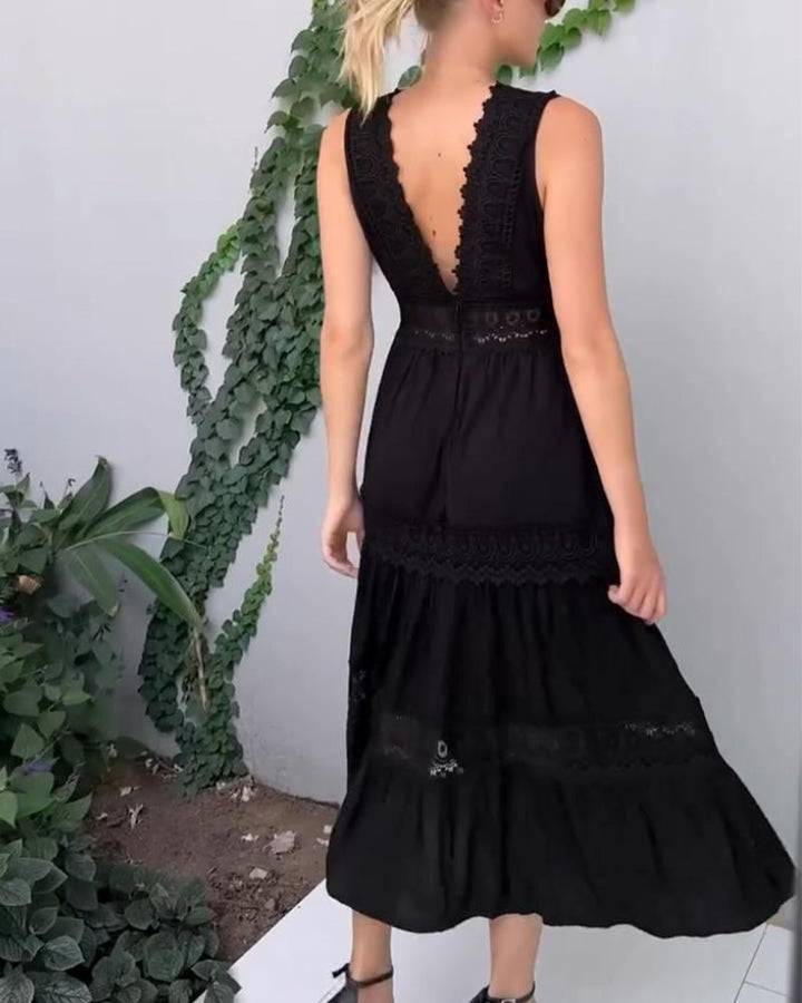 Flowing A-line skirt detail of a women's elegant lace midi dress, ideal for summer occasions.