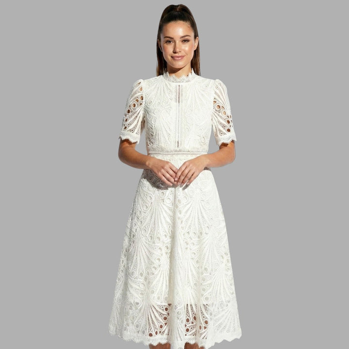 Sophisticated women's lace midi dress for formal events & special occasions, featuring high neckline & short sleeves.
