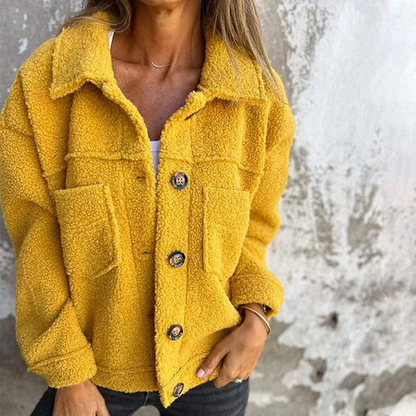 Elegant women's lapel collar jacket. Chic short outerwear perfect for autumn fashion & versatile comfort.