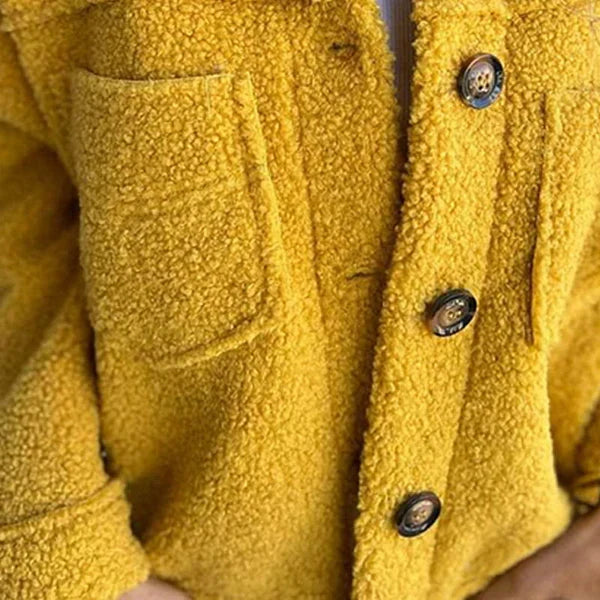 Stylish short lapel jacket for women. Elegant & comfortable button-front outerwear, a versatile autumn wardrobe essential.