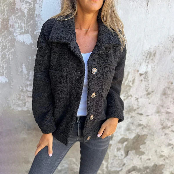 Elegant women's outerwear. Chic lapel collar jacket with a versatile button-front, ideal for fall casual or dressy looks.