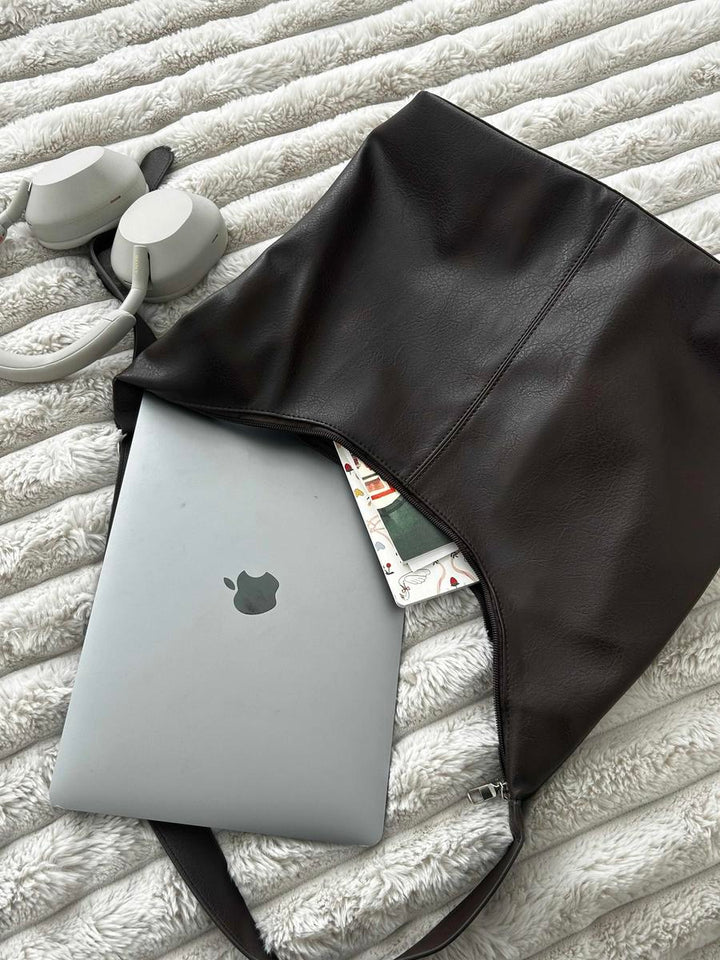 Chic women's laptop tote bag. Versatile design for office, travel & daily essentials. Elegant & secure carryall.