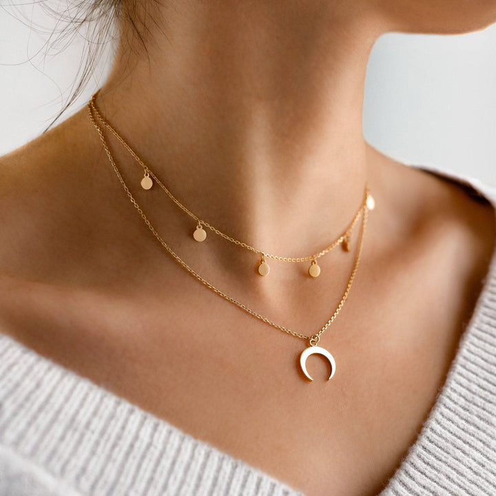 Elegant women's layered necklace featuring a delicate gold-plated crescent moon pendant. Sterling silver moon jewelry.