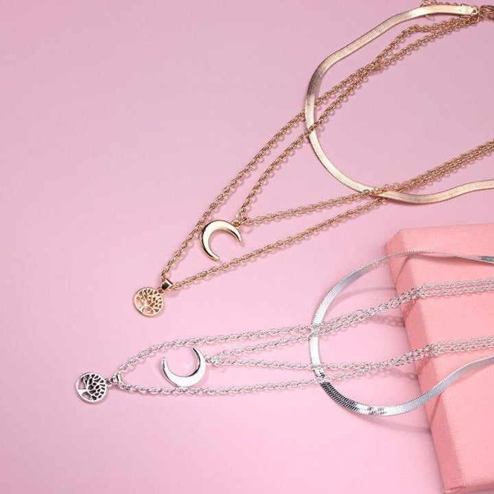 Symbolic women's layered Tree of Life & Half Moon necklace. Elegant celestial jewelry pendant for women.