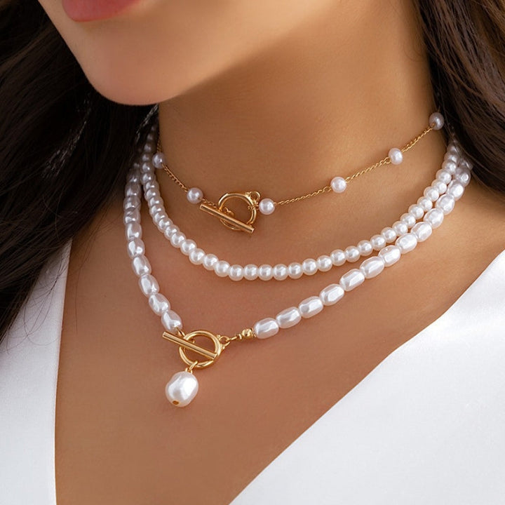 Women's layered pearl statement necklace, an elegant fashion accessory for sophisticated style and special occasions.