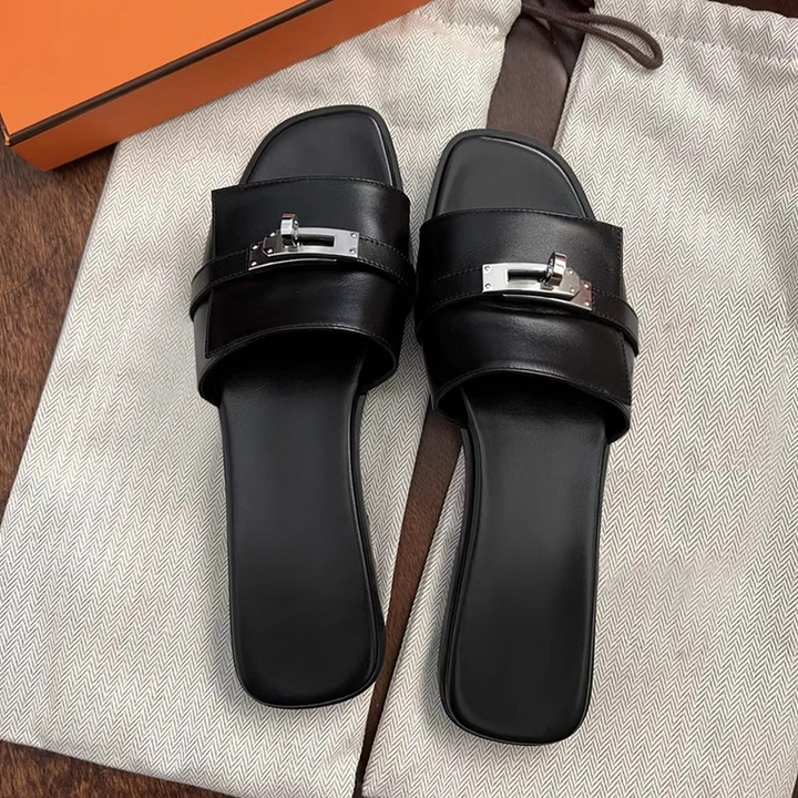 Fashionable women's square-toe leather slides. Comfortable slip-on sandals perfect for chic summer style.