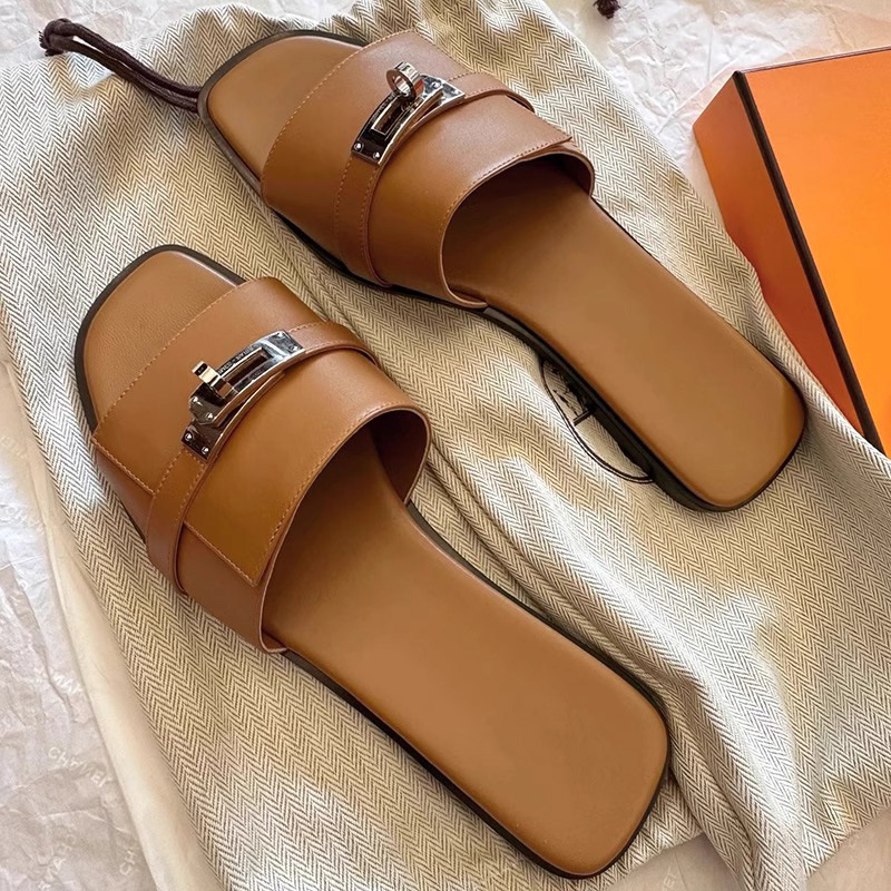 Genuine leather women's slides featuring a stylish square toe & metallic buckle. Versatile casual & elegant sandals.