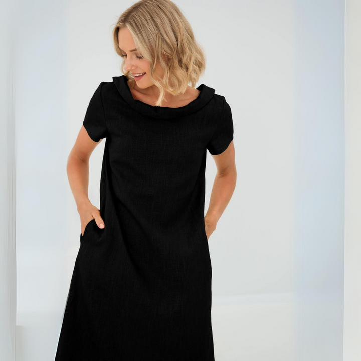 Effortless women's sleeveless midi dress in breathable linen, chic and comfortable for summer days.