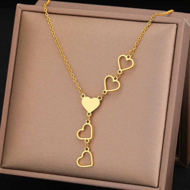 Elegant women's linked heart necklace, featuring intertwined gold & silver hearts, a timeless love symbol.