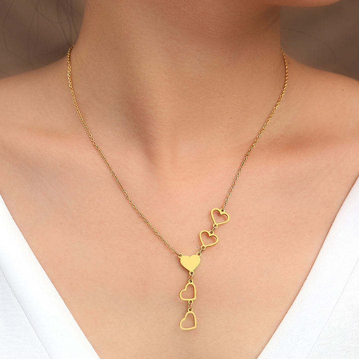 Women's gold & silver linked heart necklace. Elegant, timeless jewelry, a beautiful fashion accessory for her.