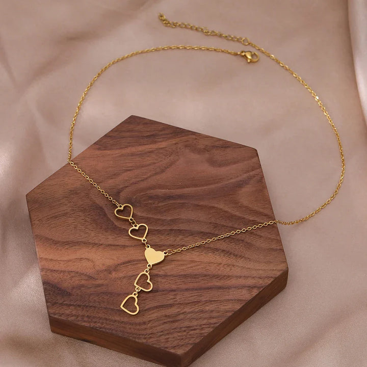 Beautiful women's linked heart necklace in gold & silver, symbolizing love and connection, a timeless jewelry piece.