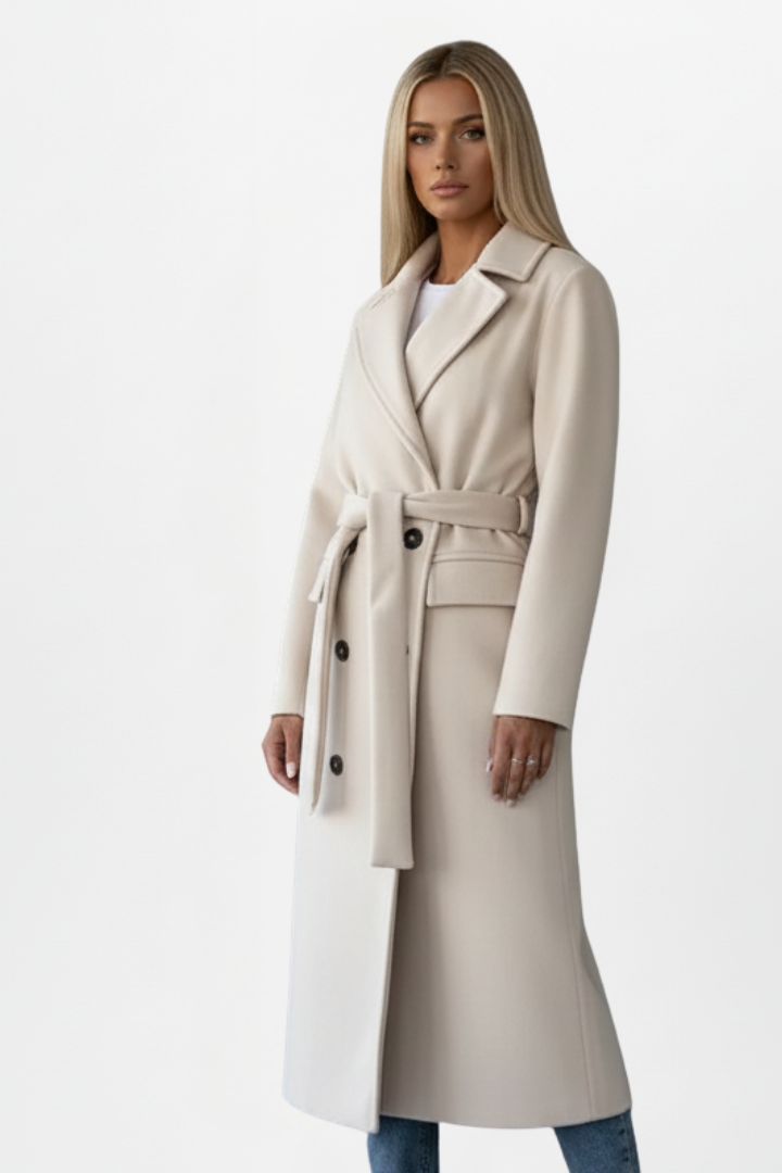 Tailored women's long coat featuring a double-breasted front & belt. Elegant notch collar design, ideal for workwear.